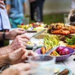 Closeup of diverse people enjoying barbecue party together