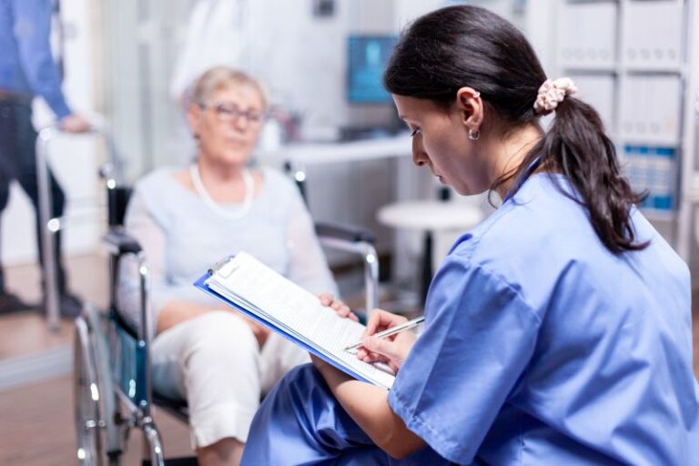 Nurse writing on clipboard