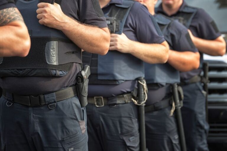 Soldiers security in the ranks, ammunition equipment and weapons, with a shallow depth of field